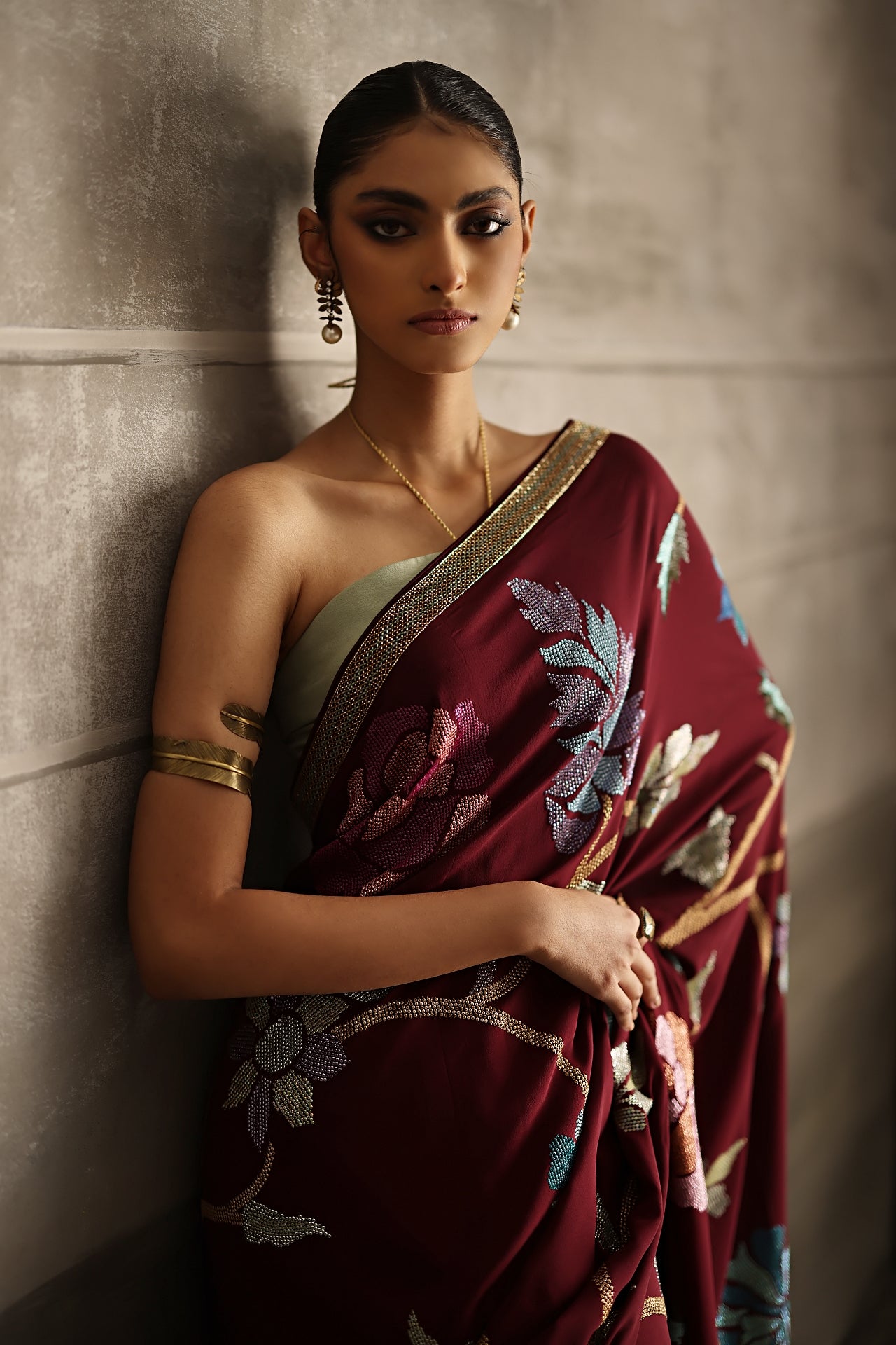 Aafrinish By Niazi Eshal Rahman Rizwan Ul Haq Deep Wine Cutdaana & Sequins Saree the rich hues of our deep wine Chiffon saree intricately detailed with floral motifs in glimmering sequins Pakistan Fashion