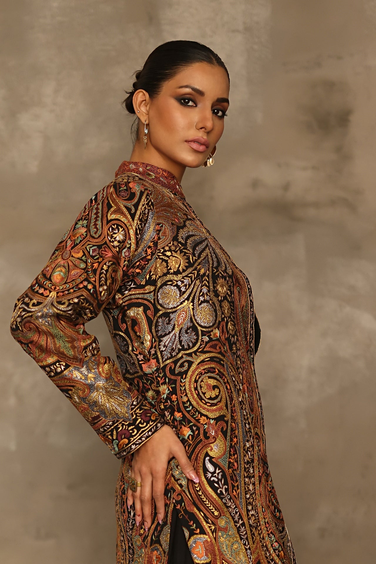 Aafrinish By Niazi Rabita Ali Rizwan Ul Haq Black Pita Tilla jacket adorned with intricate Kashida embroidery in hues of dull gold and silver zari Pakistan Fashion